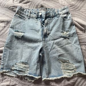 light blue jean shorts, torn fabric
